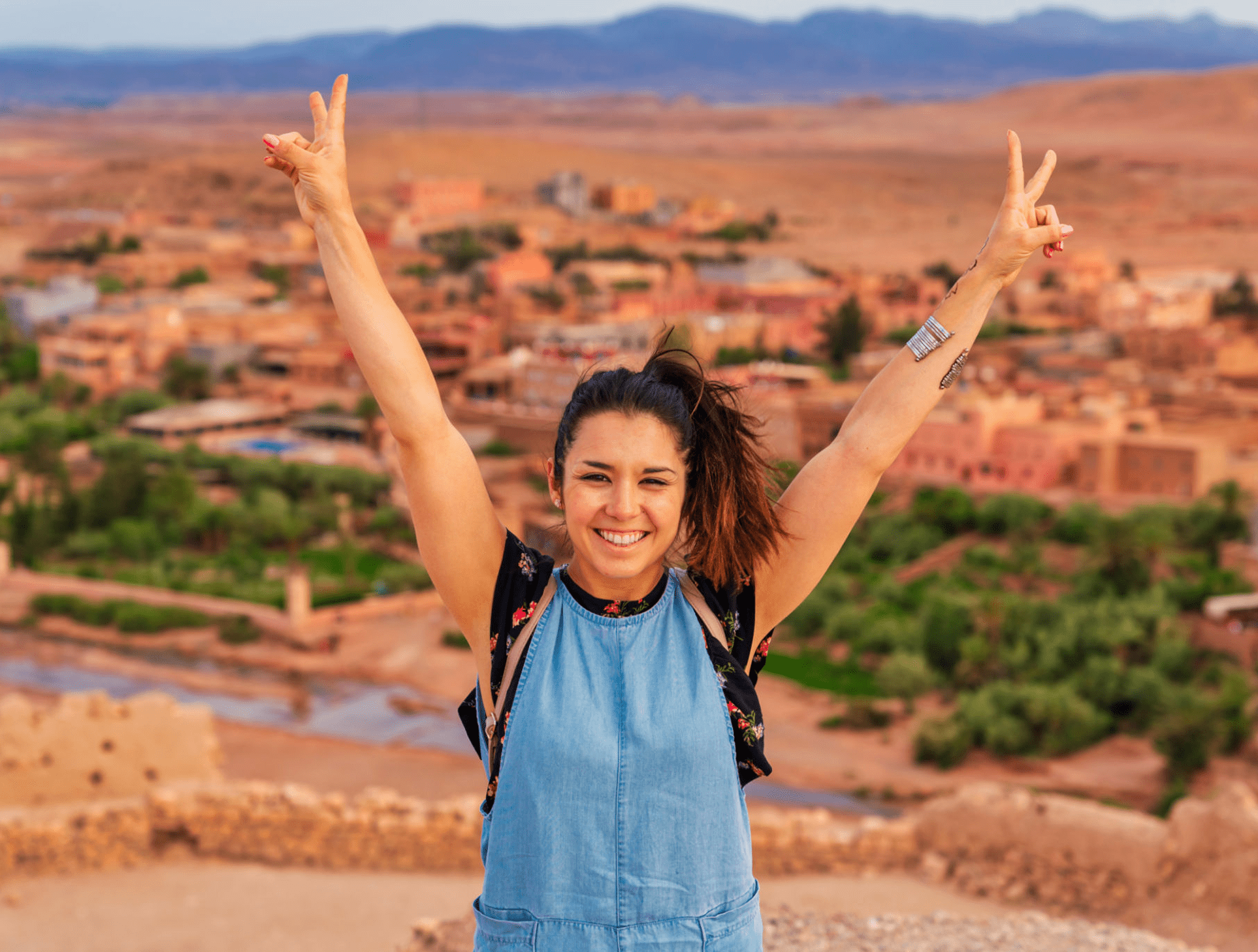 Woman celebrating with arms raised